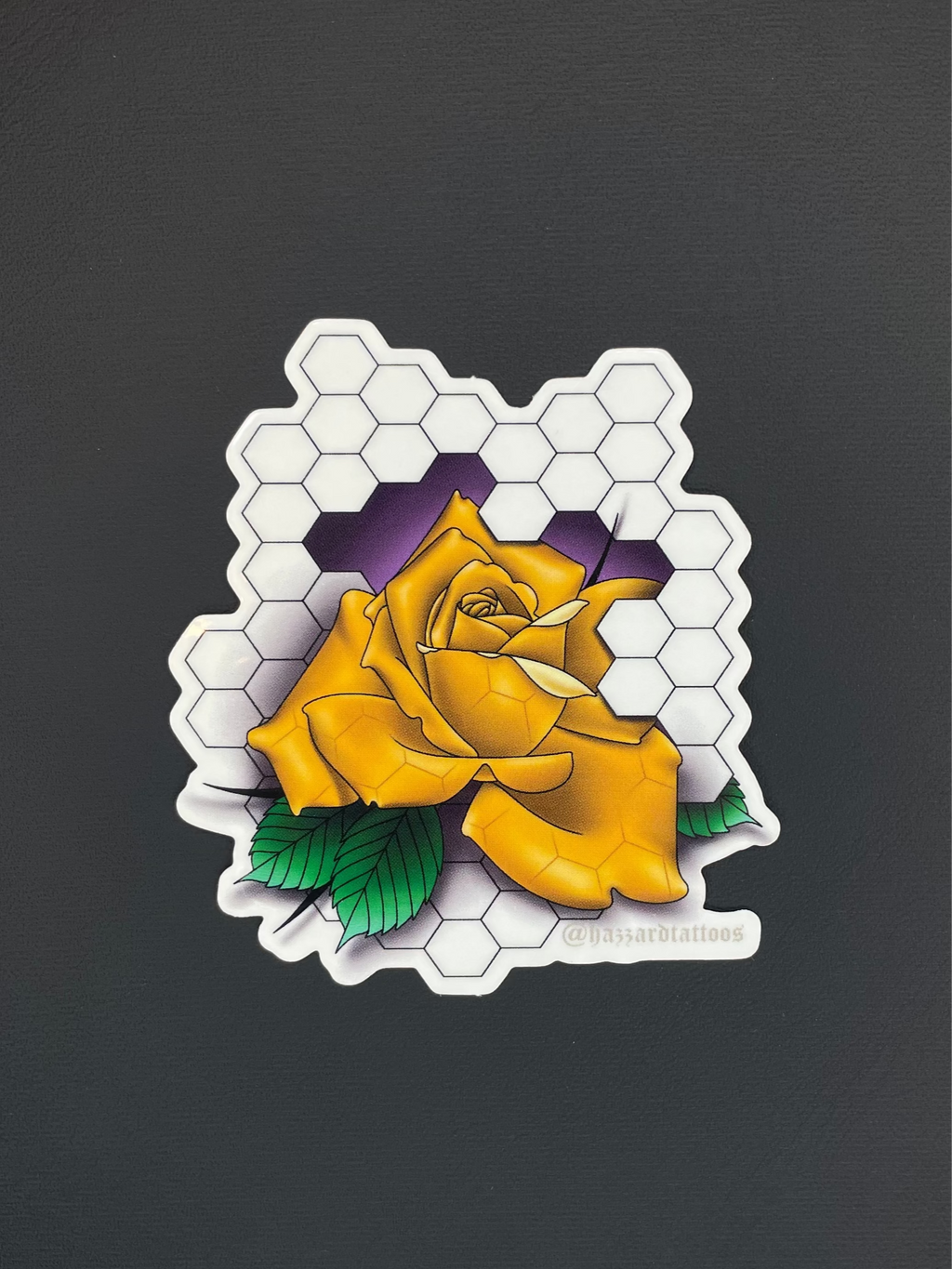 Yellow rose sticker on a black background